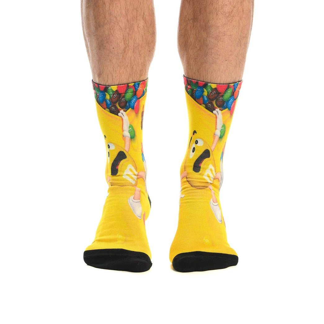 Цветни и забавни чорапи 'M&M' с игрив дизайн и ярко жълт цвят, идеални за подарък. Изработени от памук за комфорт.